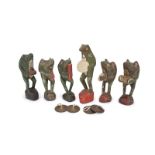 CARVED WOODEN FROG BAND A group of six graduated carved painted wooden frogs playing musical