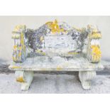 VICTORIAN STONE GARDEN BENCH A carved stone Victorian garden bench, with an inset plaque featuring