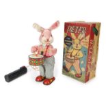 PETER THE DRUMMING RABBIT A 1950s Peter the Drumming Rabbit in original packaging.Box, 11 1/2 by 5