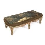 ANTIQUE FOOTSTOOLS An antique polychrome painted Louis XV style footstool with needlepoint