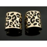 JOAN COLLINS NEWBRIDGE SILVERWARE BANGLES A pair of gold tone metal cuff bangles with open cut