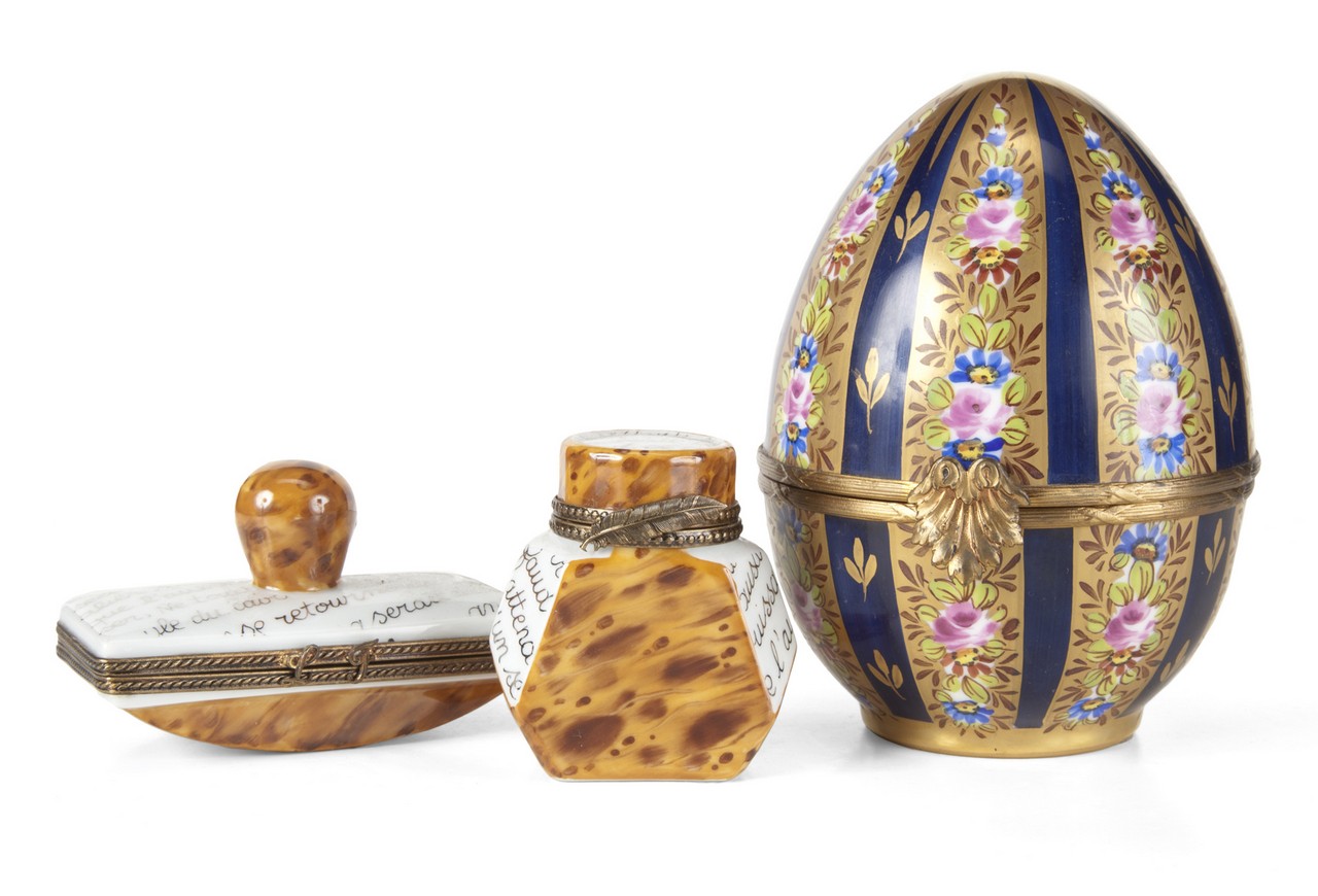 JOAN COLLINS THREE MODERN LIMOGES ITEMS Including a parcel gilt painted egg and a set of two desktop