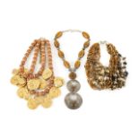 JOAN COLLINS CHUNKY NECKLACES A collection of three chunky necklaces owned by Joan Collins.