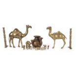 JOAN COLLINS GROUP OF BRASS CAMEL ITEMS Including 12 camel figurines, one inset with turquoise and