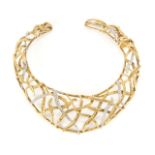 JOAN COLLINS COLLAR A gold tone collar with simulated diamonds owned by Joan Collins.