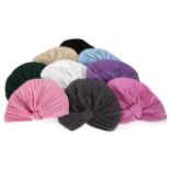 JOAN COLLINS FLORA DESIGNS TURBANS A collection of eight labeled Flora Designs turbans owned by Joan