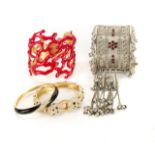 JOAN COLLINS BRACELETS A collection of four costume jewelry bracelets owned by Joan Collins. The