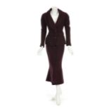 JOAN COLLINS "DYNASTY" STYLE SUIT A deep burgundy custom wool skirt suit owned by Joan Collins.