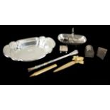 JOAN COLLINS COLLECTION OF SILVER DESK ITEMS A group of desk items including a sterling basket