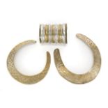 JOAN COLLINS COLLARS AND CUFF A pair of hammered silver tone collars and a silver and gold tone cuff