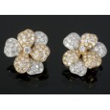 JOAN COLLINS PAIR OF DIAMOND FLOWER EAR CLIPS, DESIGNED IN 18K GOLD A pair of diamond flower