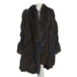 JOAN COLLINS REVERSIBLE FOX AND LEATHER COAT A dyed fox and leather reversible coat circa 1980s