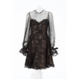 CYD CHARISSE NOLAN MILLER COCKTAIL DRESS A black lace Nolan Miller cocktail dress circa 1990s. The