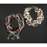 JOAN COLLINS MULTI-STRAND NECKLACES A pair of multi-strand necklaces owned by Joan Collins.