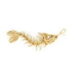 JOAN COLLINS 18KT GOLD FISHBONE PENDANT A fishbone pendant owned by Joan Collins. The earring is