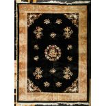 Nichols Carpet Nichols carpet, China, black field with center medallion depicting a five claw