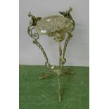 Brass Tri Footed Plant Stand with monkey mask detail, c-scroll decoration