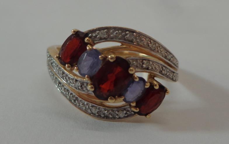 Ladies 9ct Gold Double Crossover Garnet & Tanzanite Ring with diamond points, size P