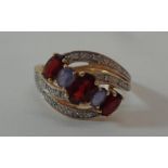 Ladies 9ct Gold Double Crossover Garnet & Tanzanite Ring with diamond points, size P