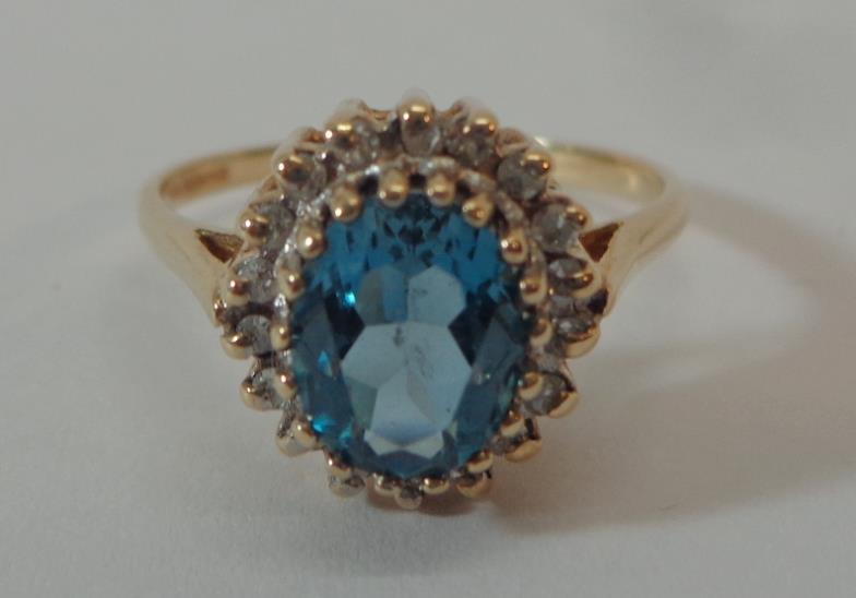 Ladies 9ct Yellow Gold Blue Topaz Ring with diamond point surround, size O