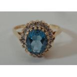Ladies 9ct Yellow Gold Blue Topaz Ring with diamond point surround, size O