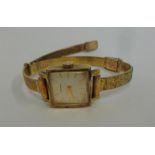 Ladies Rolled Gold Longines Wristwatch, engraved strap, square silvered dial, with original box