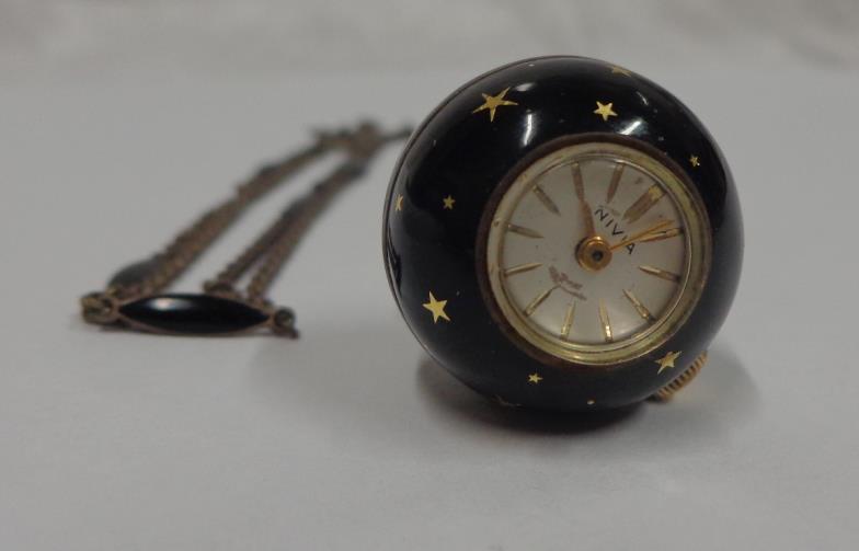 Ladies Black & Gilt Enamelled Ball Watch on white metal & black enamelled chain with Nivea movement,