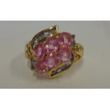 Ladies 9ct Yellow Gold Pink Sapphire & Tanzanite Cluster Ring with fretted & carved shoulders,