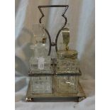 4 Bottle Cruet on silver plated stand with ball feet