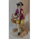 C19th Continental Porcelain Figurine Young Gentleman holding basket of flowers, wearing yellow