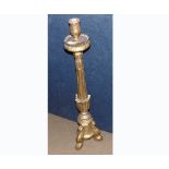 A large gilt painted Wooden Candlestick, the tapering column to a three-legged base with paw feet,