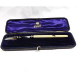 A case containing a single hallmarked Silver Pickle Fork with ivory handle, Sheffield 1889 (one fork