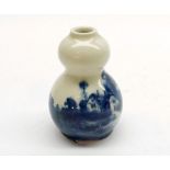 A Royal Doulton blue printed small Vase of double gourd form, decorated with a rural scene with