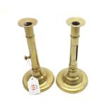 A pair of 18th or early 19th Century Brass Candlesticks, of tapering form, raised on circular bases,