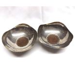 A pair of George V Silver Bon-Bon Dishes of shaped circular form, spot hammer decorated, each set to