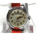 A Ladies vintage Jaquet-Droz Chromium cased Wristwatch with 17-jewel movement on red fabric