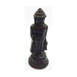 An Antique Bronze Standing Study of a Tibetan or Chinese Buddha Figure, each hand embossed in the