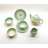 A small Susie Cooper floral decorated tea service comprising teapot, cream jug, sugar basin and