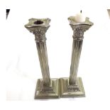 A pair of 20th Century Electroplated Corinthian Column Candlesticks on beaded square loaded bases