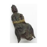 An Antique Chinese painted Bronze Model of a seated Buddhist Deity with a raised left hand and