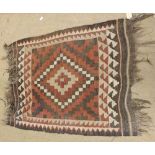 A small Kelim Prayer Rug, double gull border, central panel of geometric lozenges, brown and black