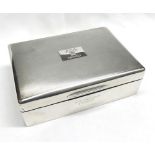 An Elizabeth II Silver Encased Cigarette Box, rectangular shaped, the engine-turned lid bearing a