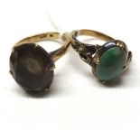 Unmarked yellow metal Jade panelled ring together with a mid-grade yellow metal Smokey Quartz ring