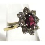 A mid 20th Century high grade precious metal Cluster Ring set with an oval Ruby to the centre