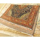 A large 20th Century Pakistani Wool Rug, decorated in various colours with stylised foliage and