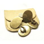 Pair of early 20th Century high grade yellow metal cufflinks, plain oval design with figure of eight