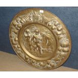A large Brass Wall Plaque, classically decorated with central scene of cherubs, the border with