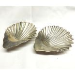 A pair of Edwardian Silver Butter Shells of typical form, supported on three ball feet, London