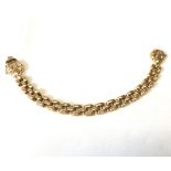 A hallmarked 9ct Gold brick link Bracelet with shell formed clasp, 19cms long, weighing approx.