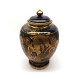 A 20th Century Satsuma covered Jar of tapering baluster form, decorated predominately in iron red